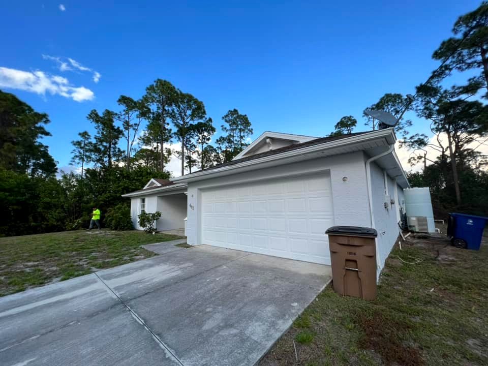 Exterior home painting driveway angle by AMM PAINTER LLC